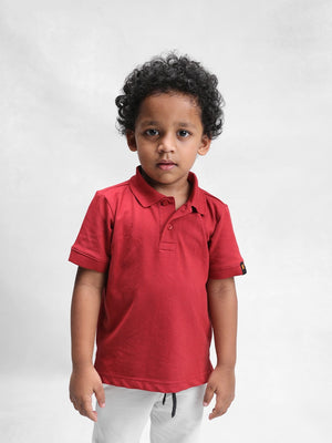 Kid wearing the clay classic polo