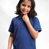 Kid wearing the navy classic polo