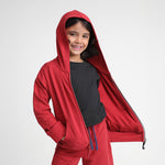 Kid wearing Kiggle All Weather Hoodie in Clay