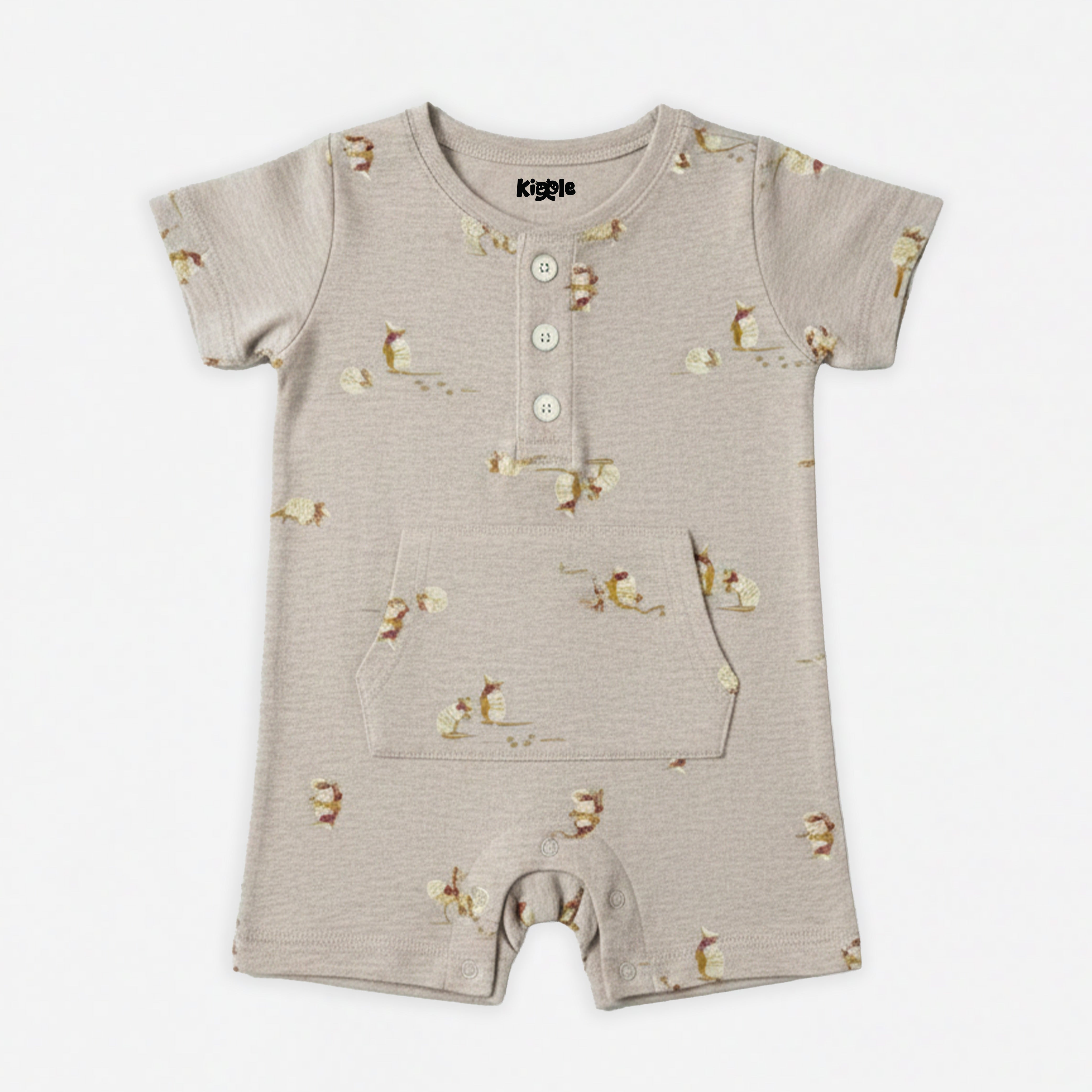 Kiggle organic cotton baby shorty romper in warm oat with scattered armadillo print, button placket neckline, azo-free dyes, sizes 3 to 24 months